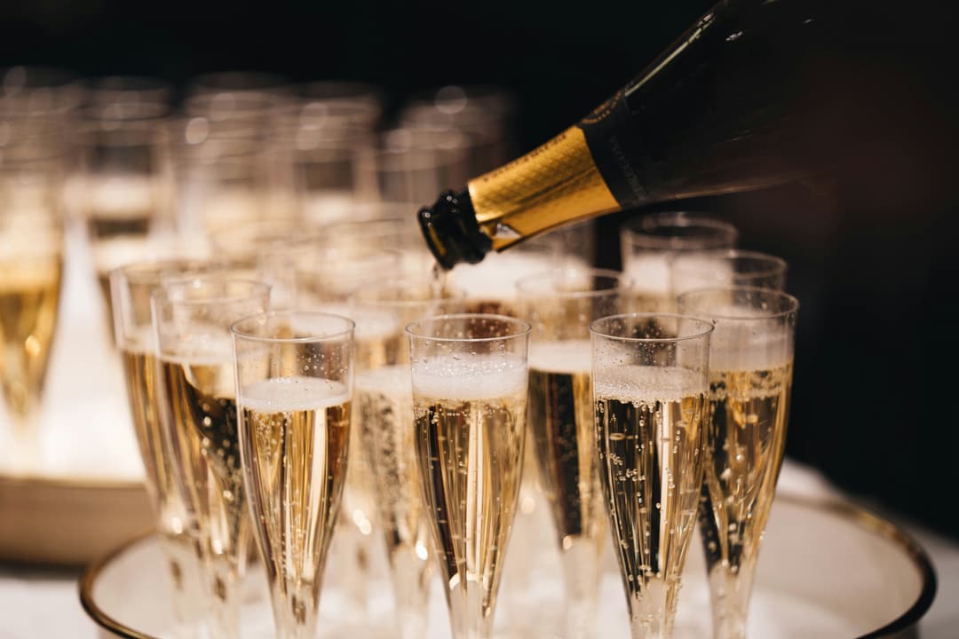 Champagne bottle with glasses of champagne