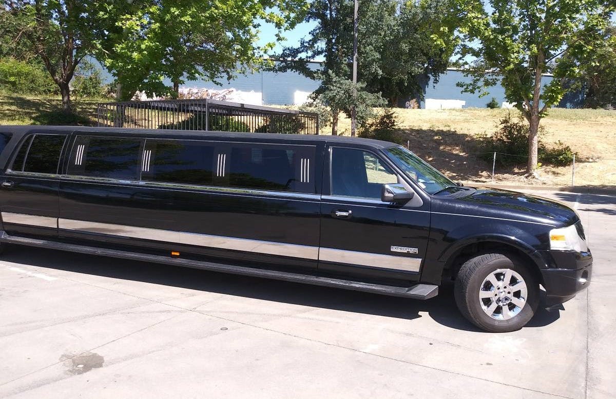 Black luxury limousine in a parking lot